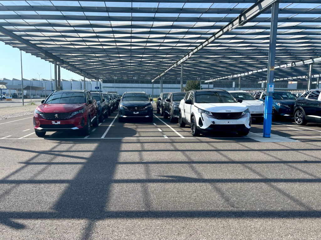 an electric car at a modern charging hub, illustrating fleet options for independent car rental operators.