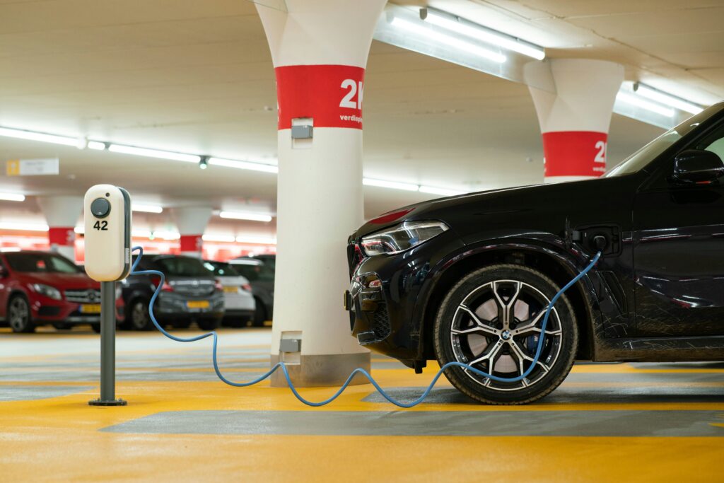 an electric car at a modern charging hub, illustrating fleet options for independent car rental operators.